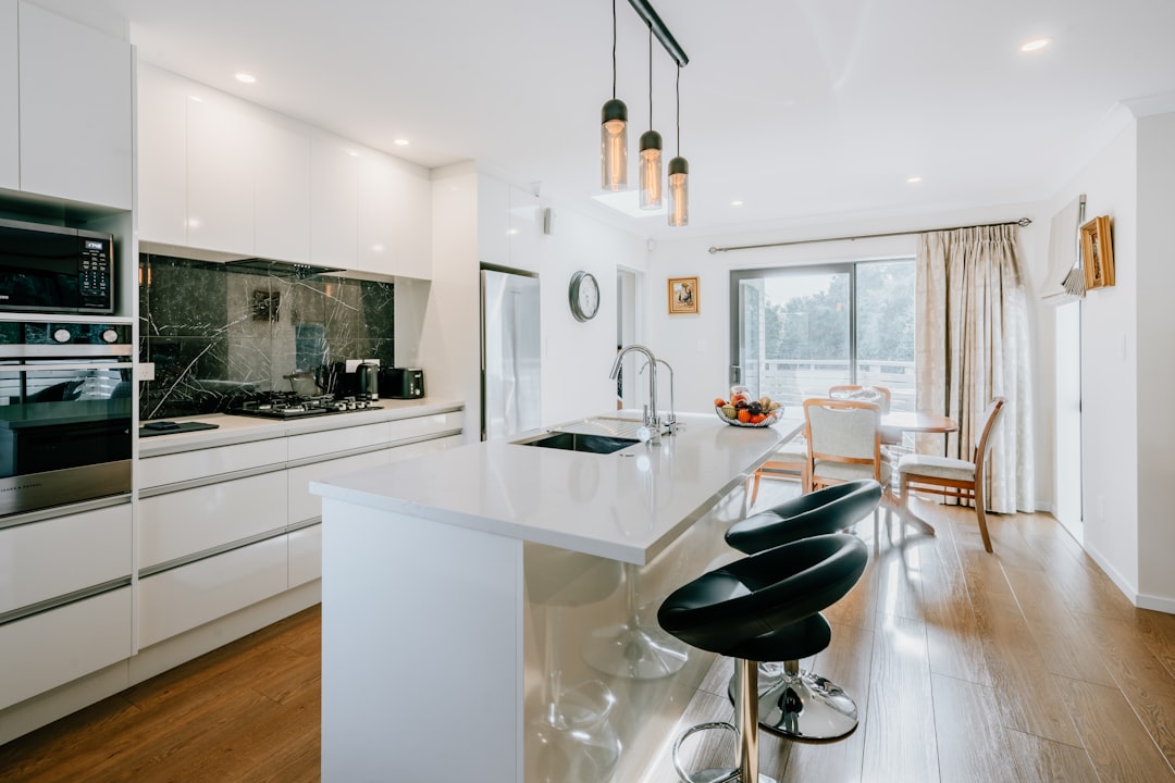 A beautifully renovated modern kitchen with clean lines, new appliances, and stylish fixtures, showcasing a smart way Louisville homeowners can invest their real estate commission savings back into their property.