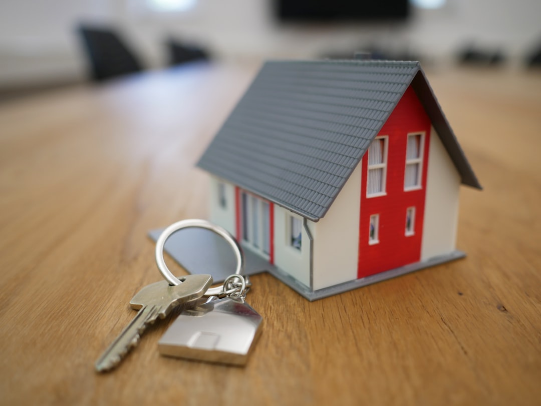 A real estate agent hands a set of house keys to a smiling couple, symbolizing a successful home sale achieved through smart financial incentives and marketing.