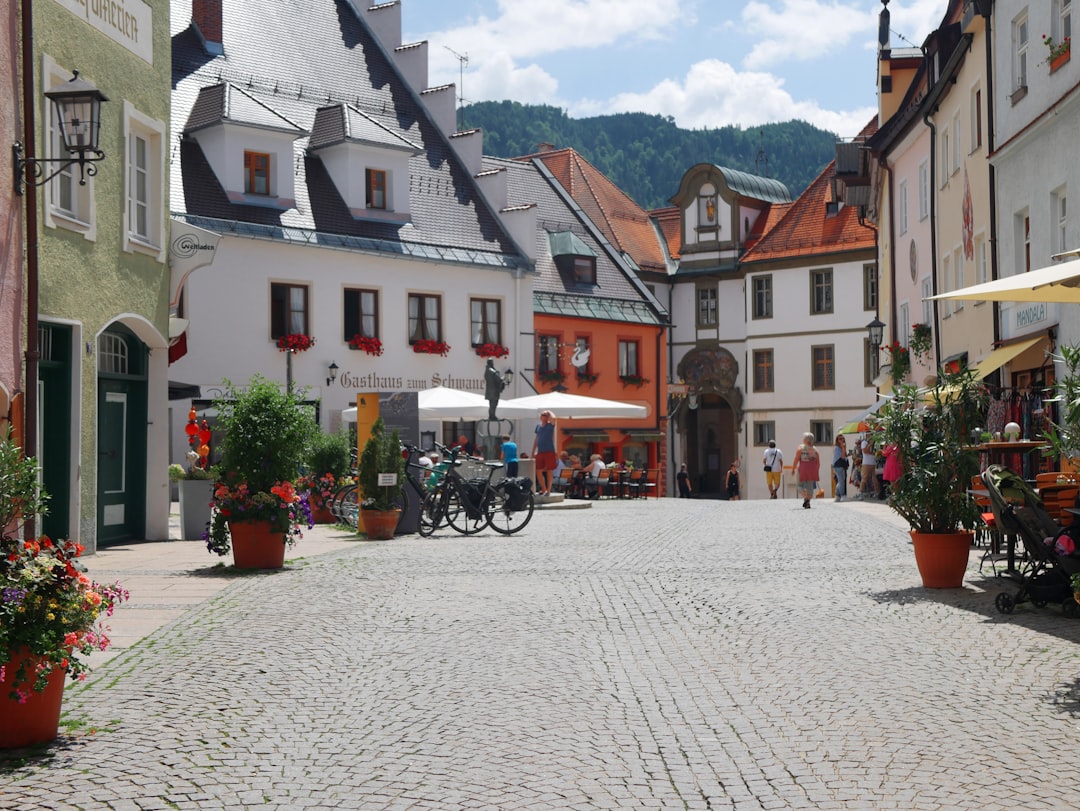 Bright, sunny day on a charming main street lined with local shops and boutiques, showcasing a walkable urban neighborhood.