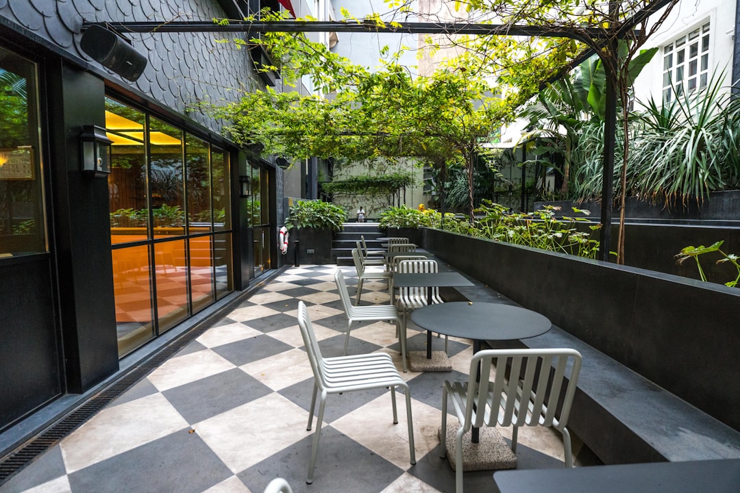 A bright and inviting luxury backyard patio with comfortable seating, staged for an outdoor party, ideal for a home seller in Louisville.